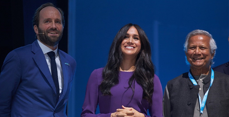The Duchess of Sussex (center) and Muhammad Yunus (right)