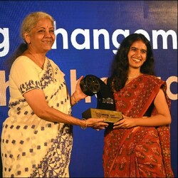 Prachi Shevgaokar receiving an award on stage