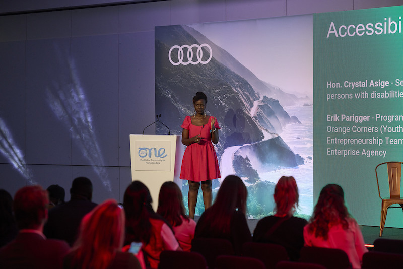 Crystal Asige presenting on the 'Empowering Progress / Audi Stage' at OYW Manchester Summit 2022