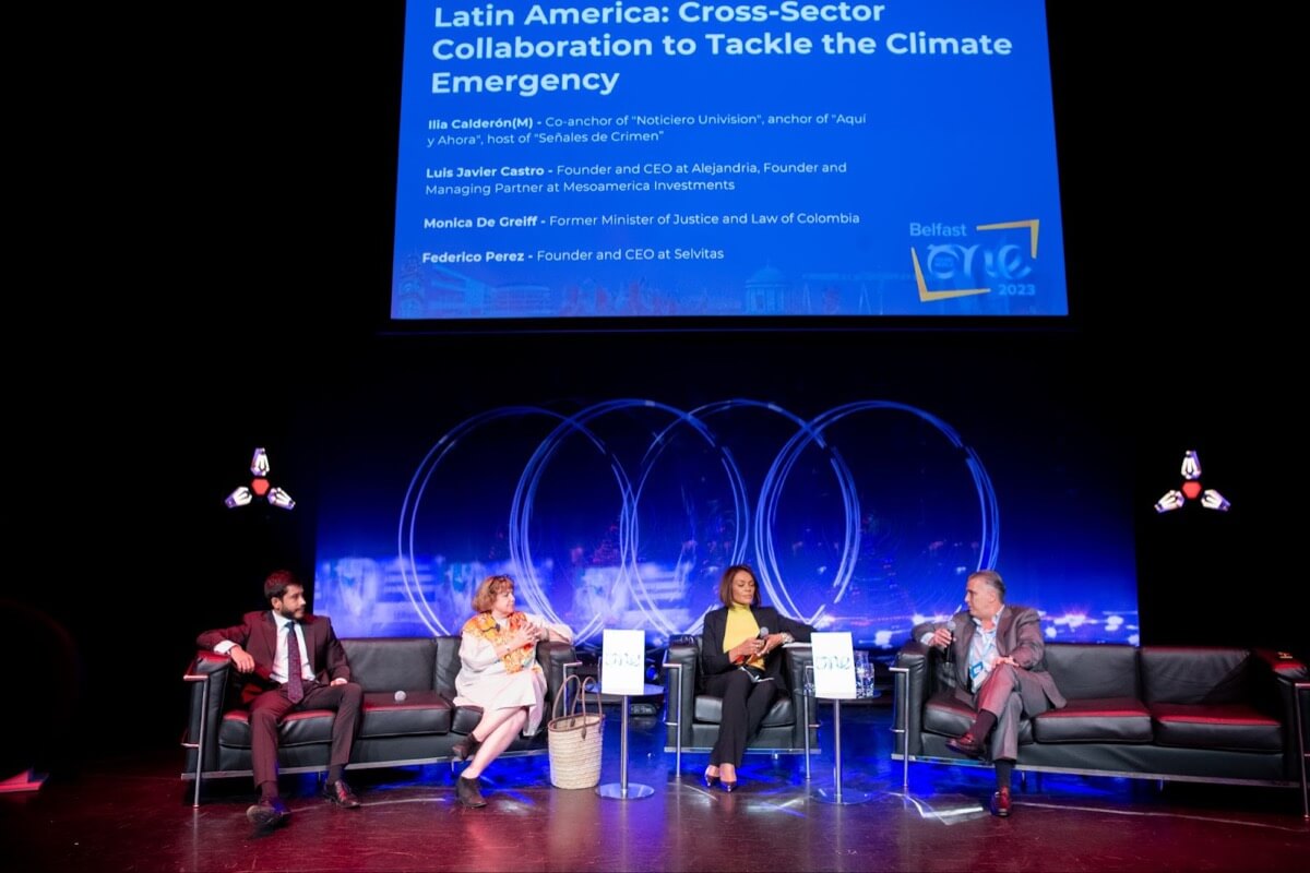 Presenters speakers on the audi stage for a session on Latin America cross sector collaboration tackling climate emergency
