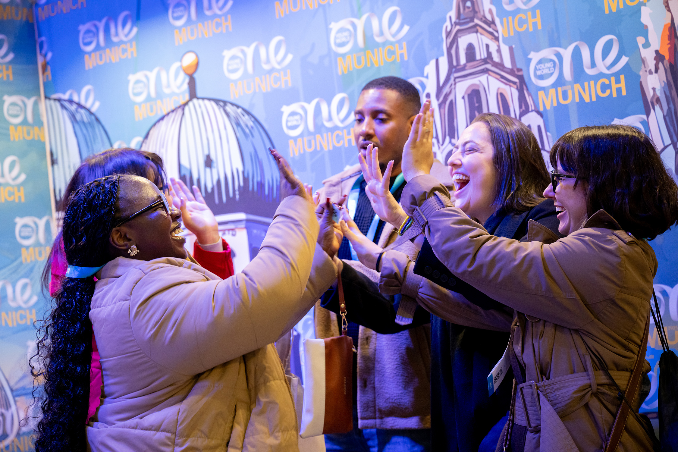 Delegates high-fiving - Munich, 2025