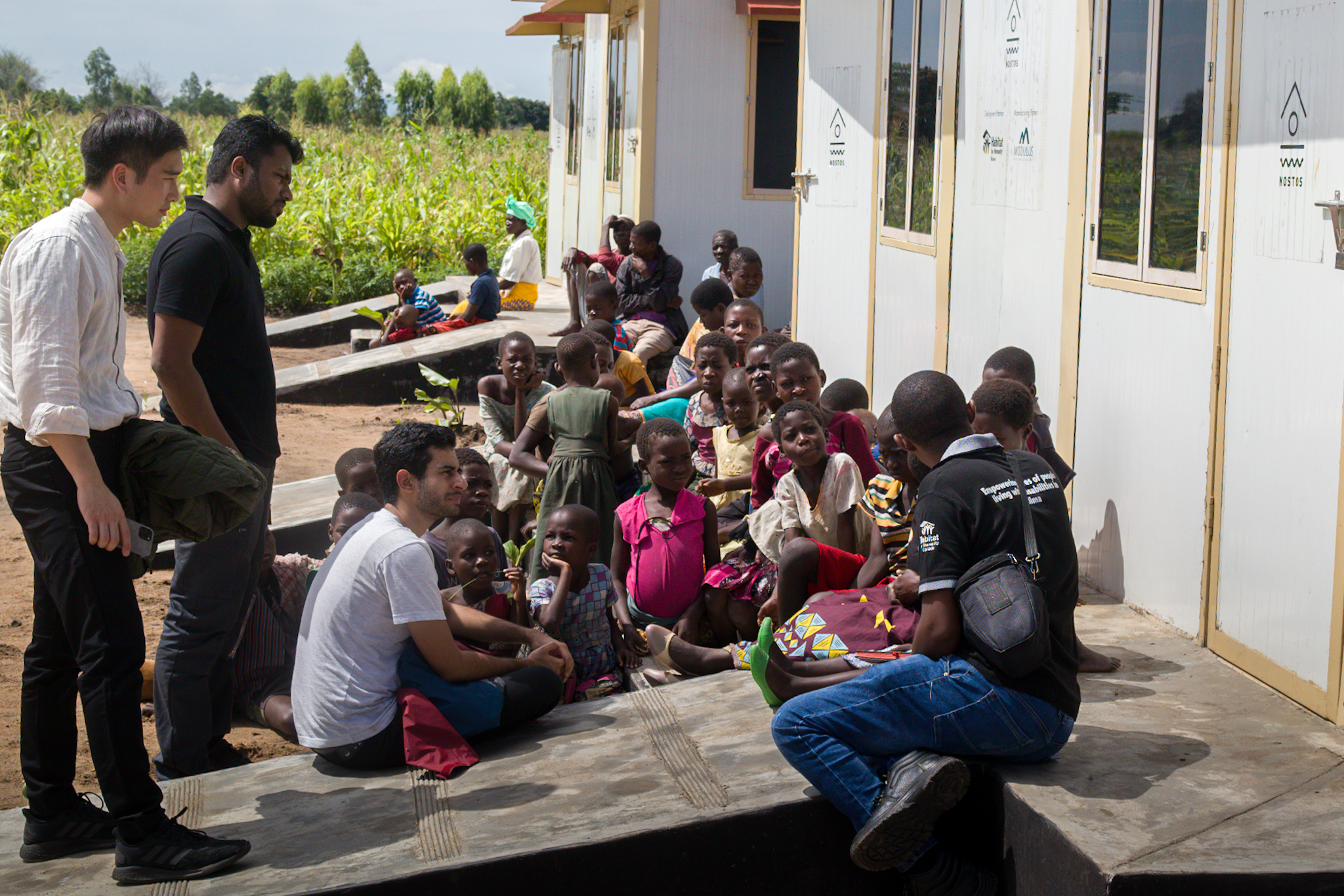 Nostos and Habitat leadership talk to children in Phalombe