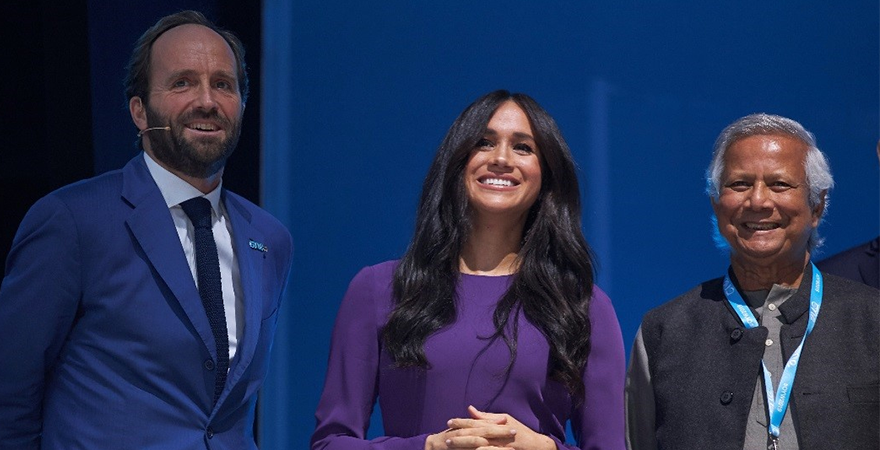 The Duchess of Sussex (center) and Muhammad Yunus (right)