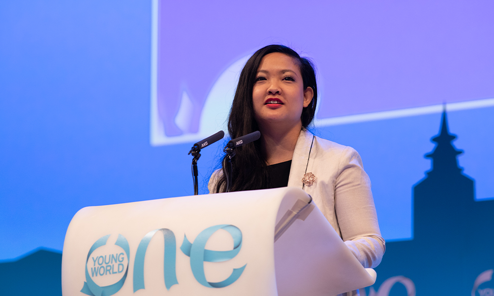 Image of activist speaking at One Young World Summit