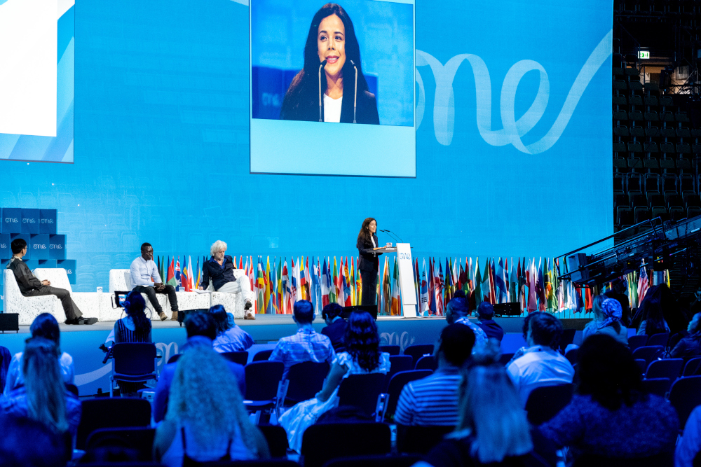 Speaker on the presentation stage at OYW Summit