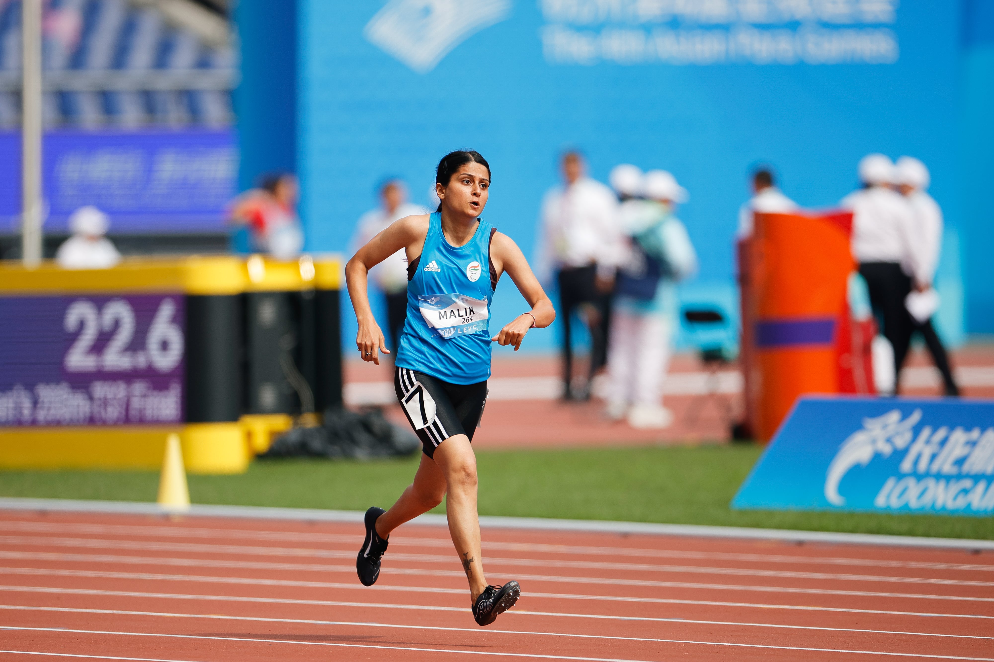 Devika running at the 4th Asian Para Games
