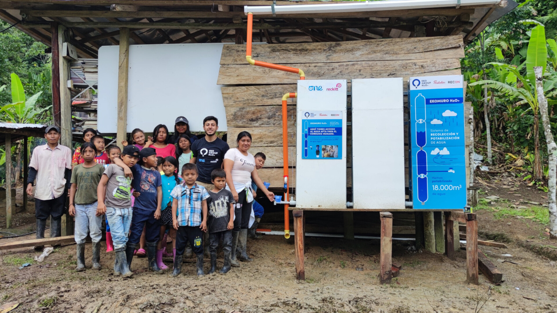 Group photo next to rainwater system