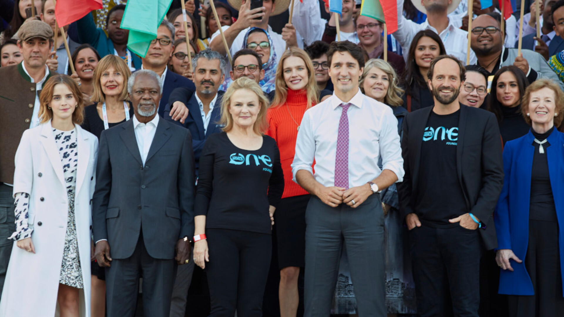 Group photo of smiling OYW Co-Founders, celebrities, dignitaries, flag bearers 