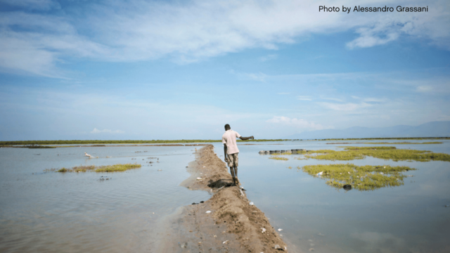 Man walking on sandbank 