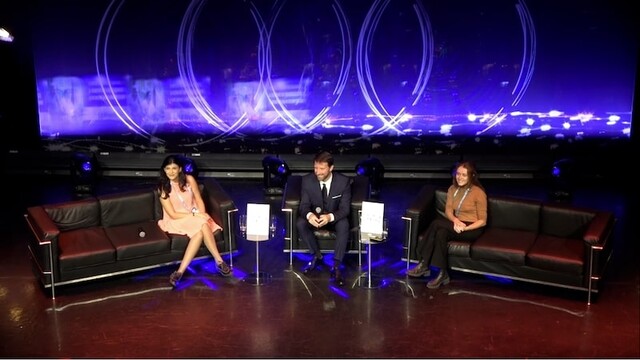 Théo Panizzi moderating a panel on the Audi Stage with Anne Sophie Roux and Sabrine Chennaoui