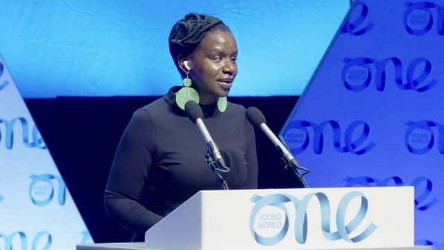 Crystal Asige presenting at OYW Belfast Summit 2023 presentation stage