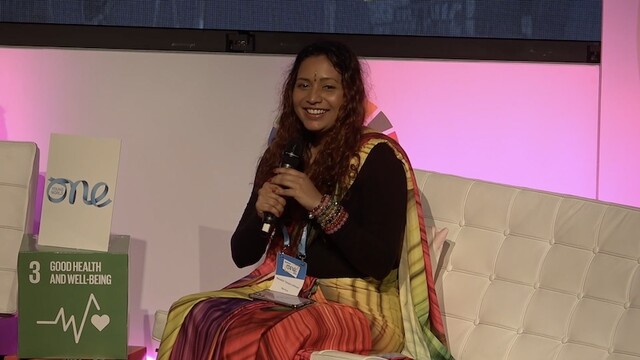 Nandini speaking on the Reckitt stage about Safeguarding LGBTQ+ Rights Global Perspectives