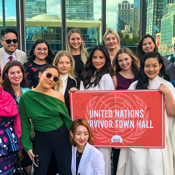 Group Photo with UN Survivor Town Hall Placard