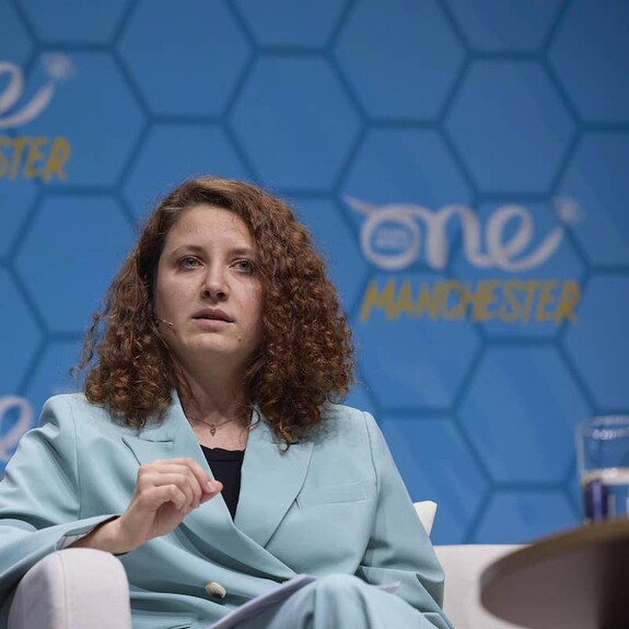 Photo of Hanna Liubakova on stage at Manchester OYW Summit 2022