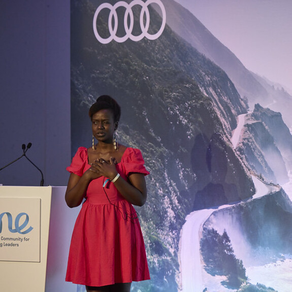 Crystal Asige presenting on the ‘Empowering Progress / Audi Stage’ at OYW Manchester Summit 2022