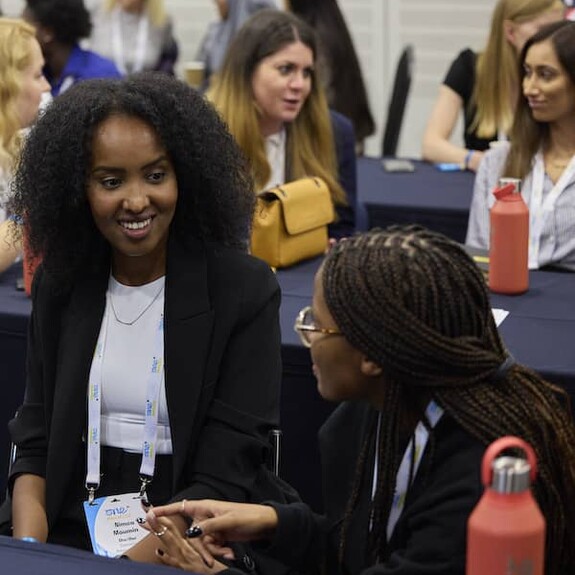 Enthusiastic delegates at the summit deep in discussion