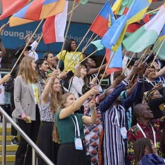 Flagbearers on the steps of the OYW Manchester Summit Venue