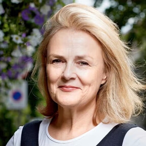 Portrait of Kate Robertson against floral background