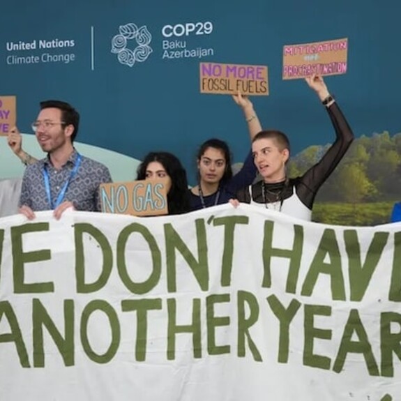 Activists participate in a demonstration with a sign that says "we don't have another year!" at the COP29 U.N. Climate Summit, Tuesday, Nov. 19, 2024, in Baku, Azerbaijan