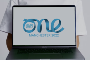 Laptop monitor displaying One Young World Manchester 2022 Logo