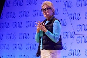 Kate Robertson speaking on stage