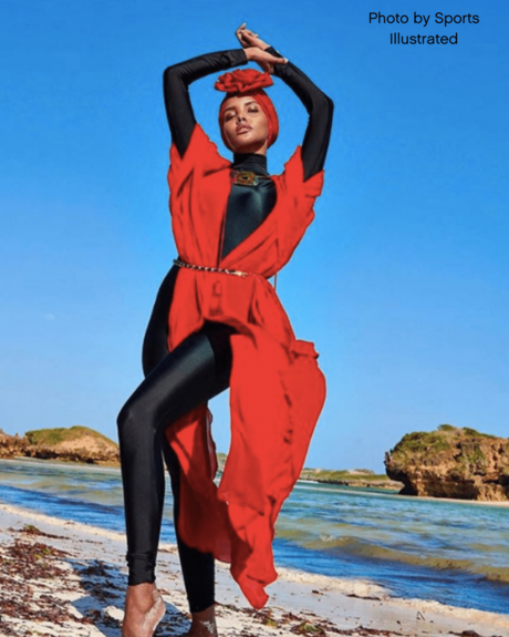 Halima Aden posing on a rock