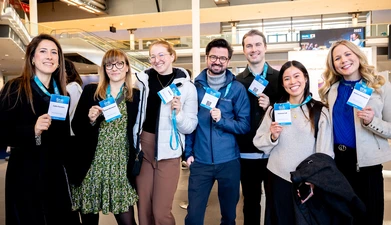 Delegates with badges - Munich 2025