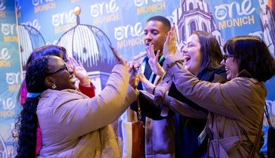 Delegates high-fiving - Munich, 2025