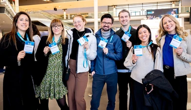 Delegates with badges - Munich 2025