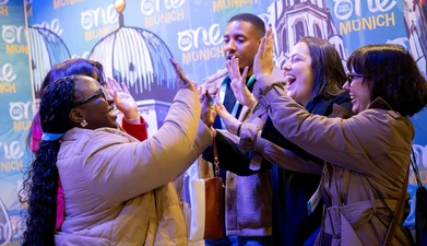 Delegates high-fiving - Munich, 2025