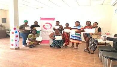 group of women pose with certificates