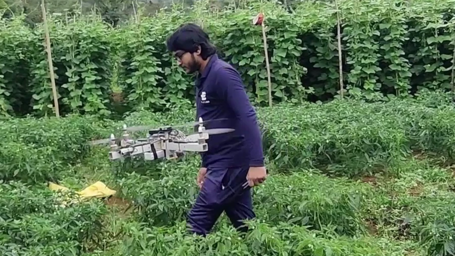 Lilan working in a field with a drone for Elzian Agro.