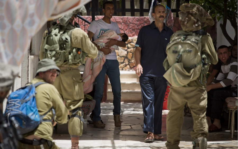 men holding guns and man holding a baby