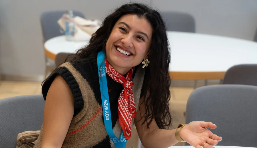 Woman smiling with red bandana around her neck