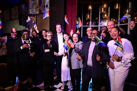 Group photo of OYW staff and affiliates announcing and celebrating the 2026 Cape Town Summit