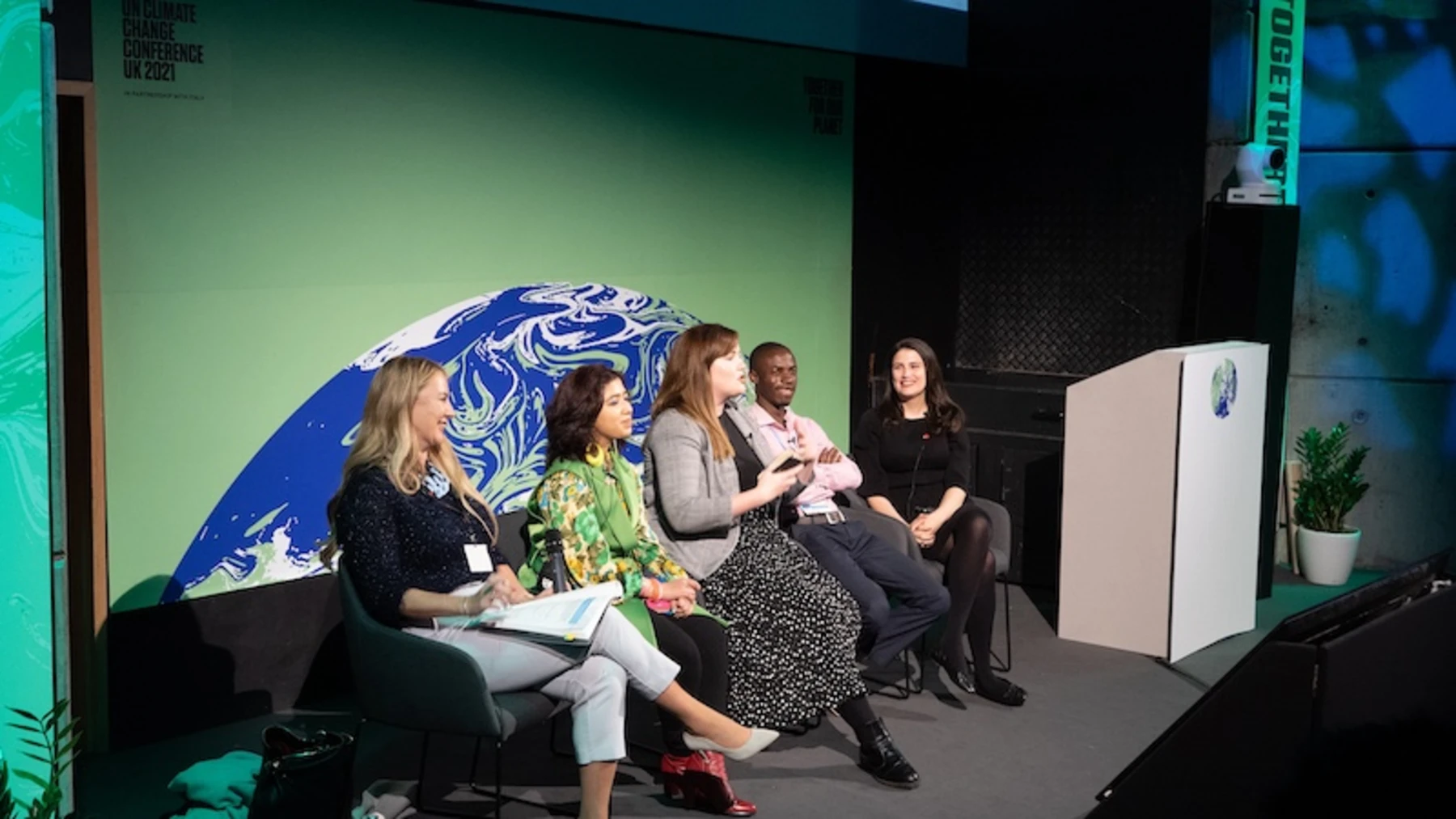 OYW ambassadors on stage with MD Ella Robertson McKay-COP26 Glasgow 2021