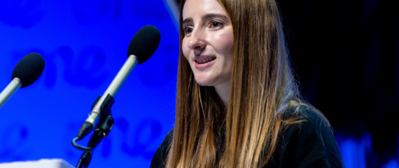 Picture of Anxhela Bruci speaking on stage at the One Young World Summit Belfast, 2023