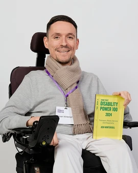 Joshua Wintergill holds his disability power 100 award