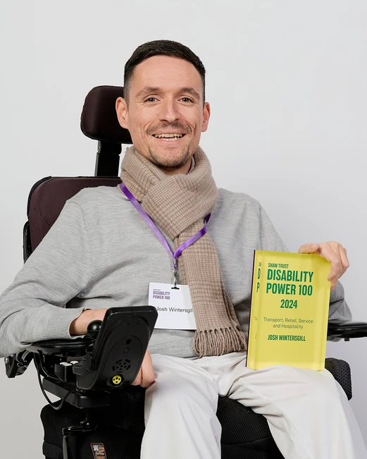 Joshua Wintergill holds his disability power 100 award