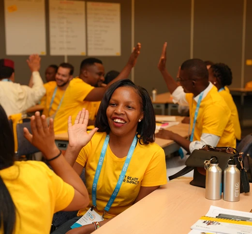 Young leaders smiling and giving each other a high-five