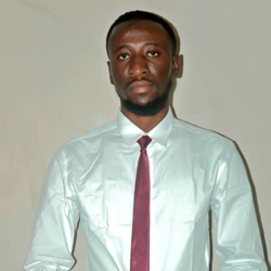 Portrait of Moussa in a shirt and tie