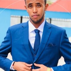 Mohamed Ahmed Yasin portrait wearing navy blue suit and tie