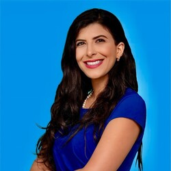 Sabrine Chennaoui in royal blue top against blue background